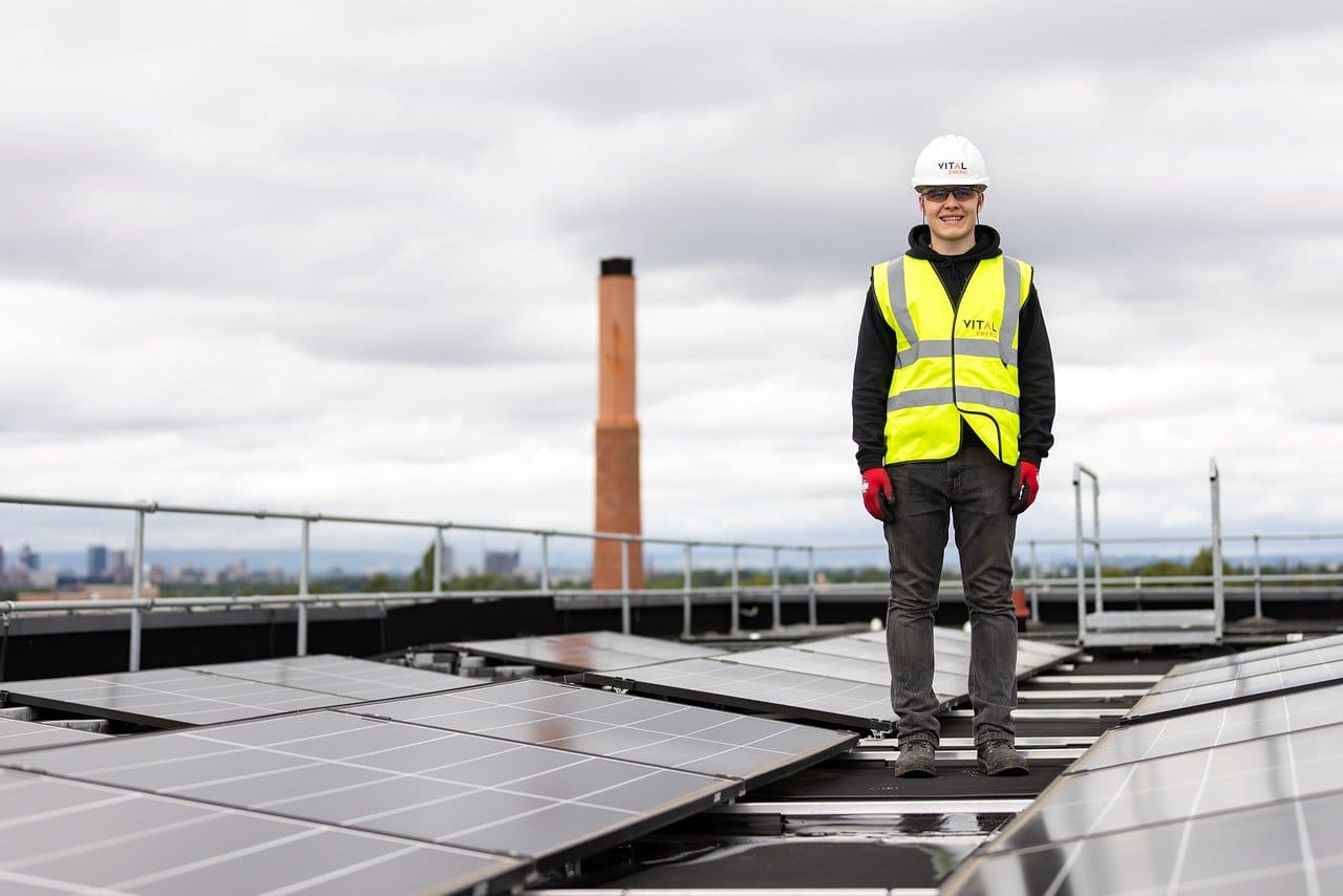 A UK business rooftop covered in solar panels, symbolising a shift to renewable energy in 2024