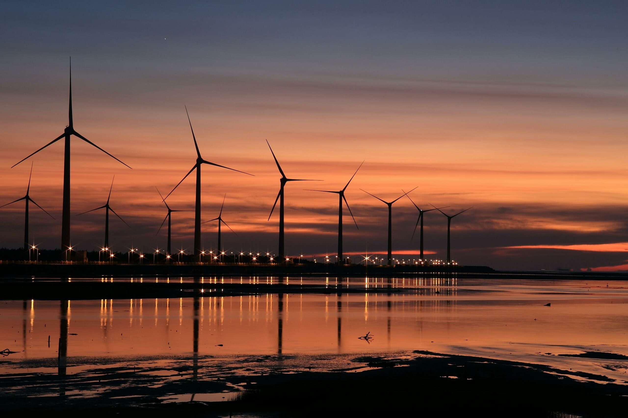A bustling UK business district with wind turbines symbolising renewable energy investments